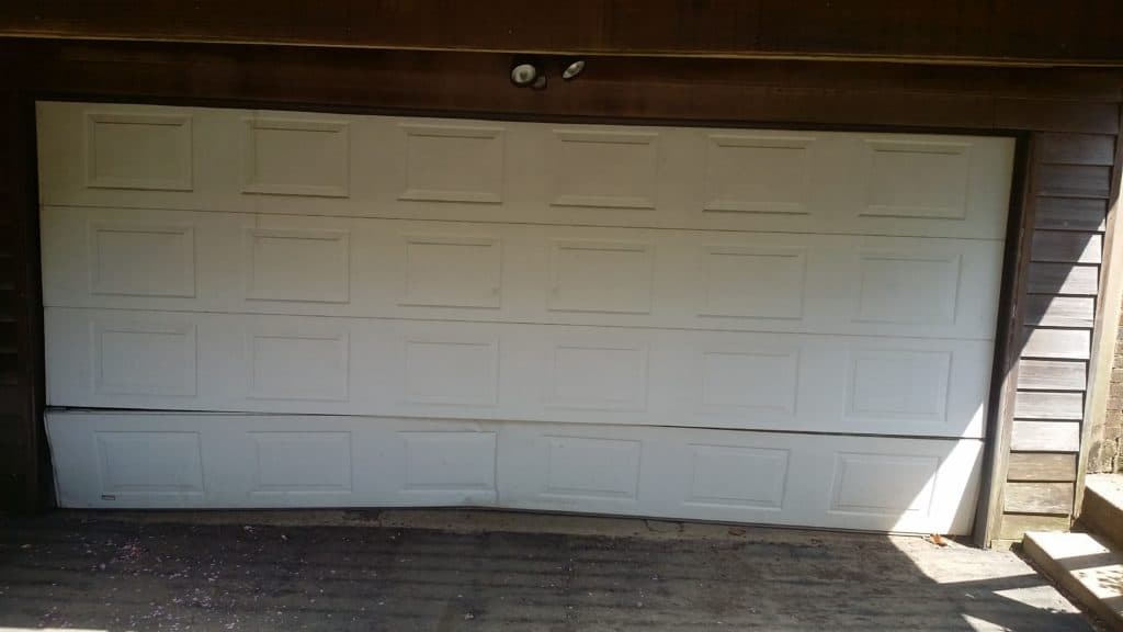 Dented garage door section