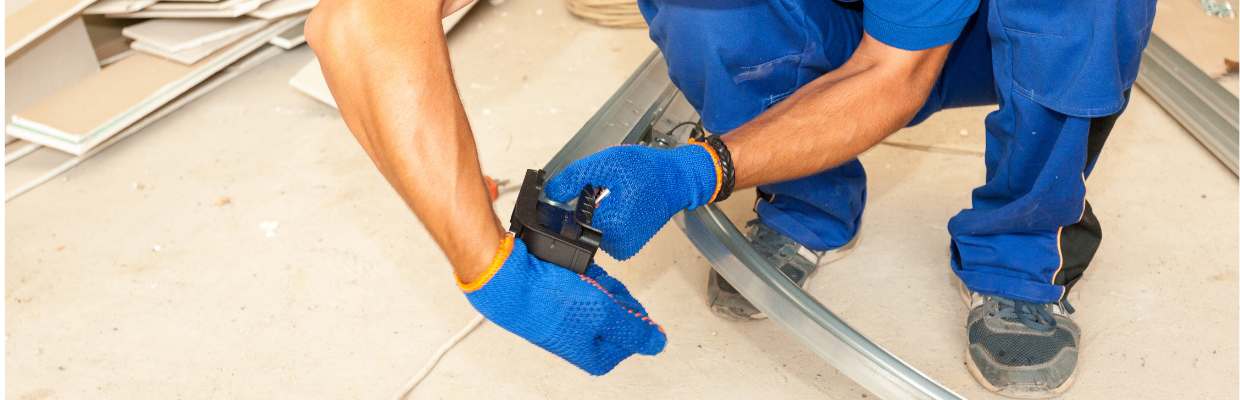 Man working on garage door track